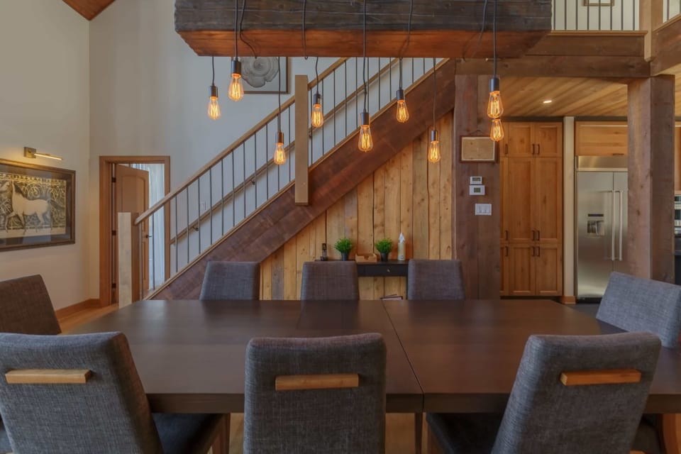 Elegant dining area under exposed beams with seating for large groups