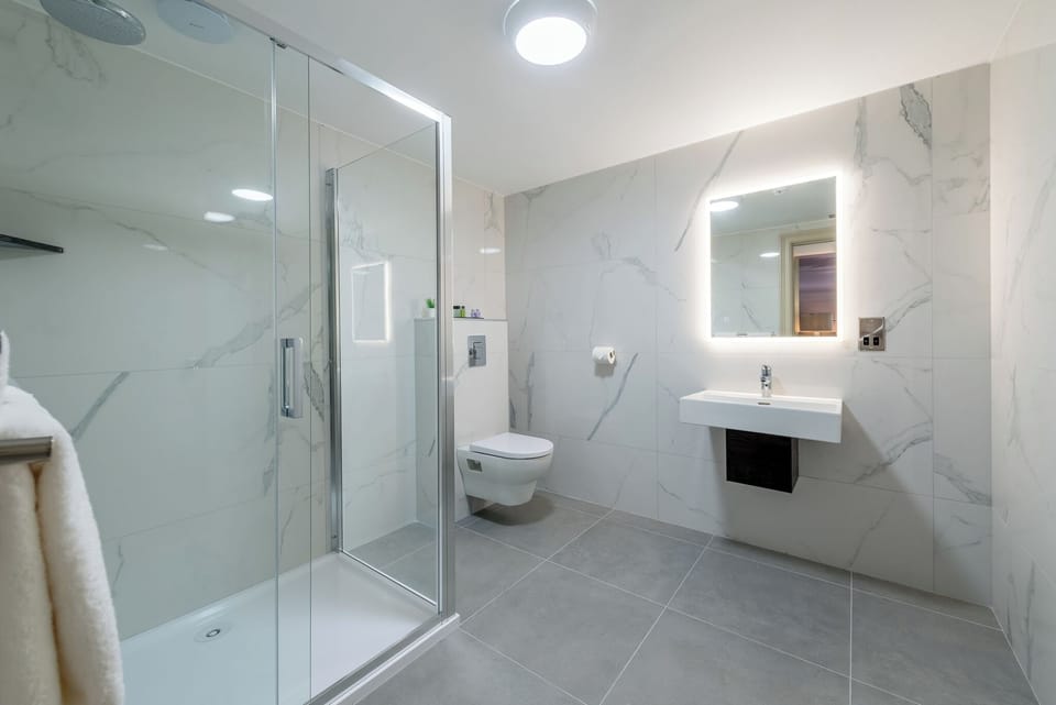Shower, rainfall showerhead, eco-friendly toiletries, hair dryer