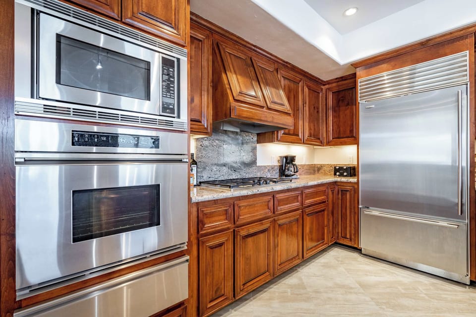 Kitchen | Oven | Microwave | Warming Drawer | Oversized Refrigerator | Five-Burner Gas Stove-Top.