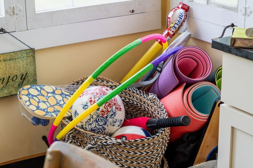 The fun corner!  Yoga mats, wiffle ball, soccer, a baseball glove , pickle ball , croquet, frisbee, badminton (the net is outside on the lawn..) and in winter, tubes for tubing in the back yard if you`re lucky enough to get snow! Enjoy