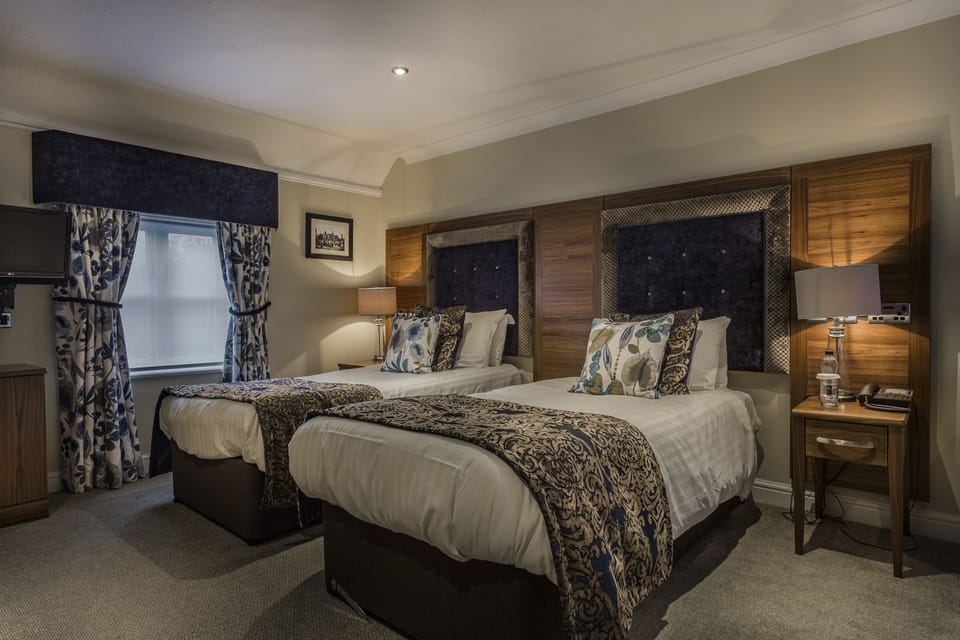 Premium bedding, desk, blackout drapes, iron/ironing board