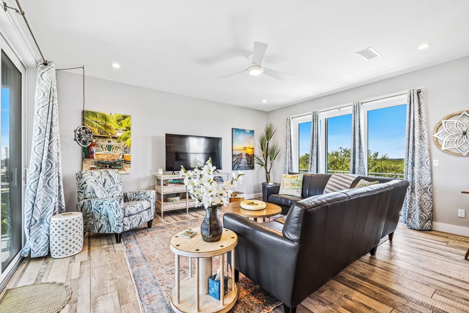 Spacious living room with access to two balconies.