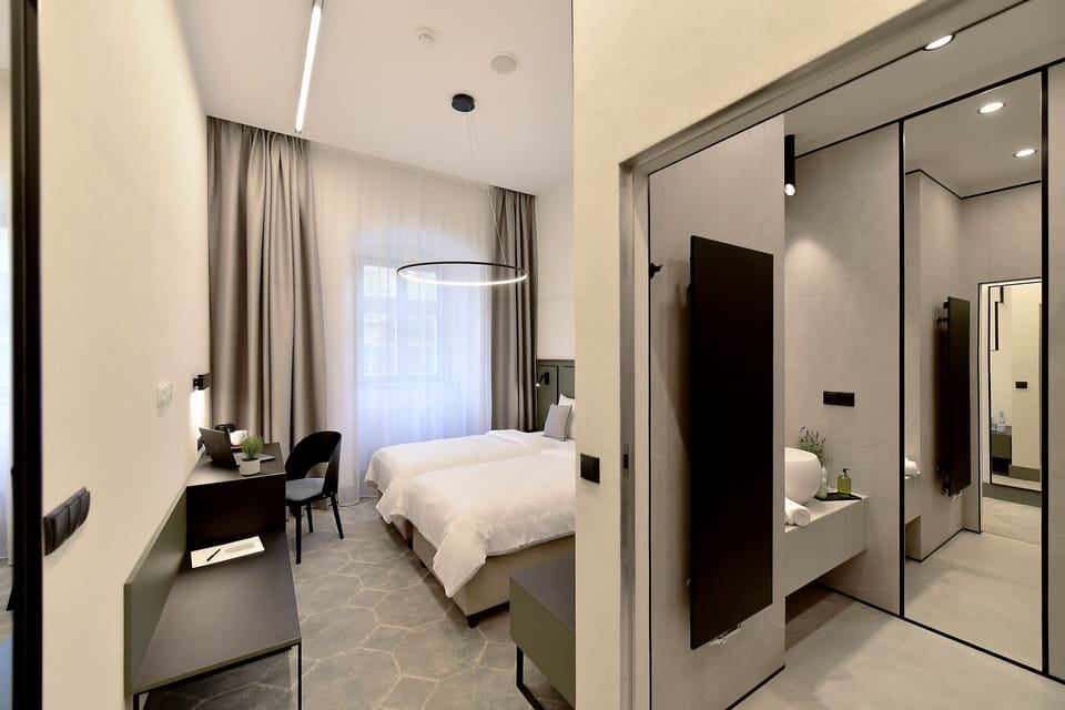 Standard Twin Room | Living area | 32-inch LCD TV with satellite channels, TV