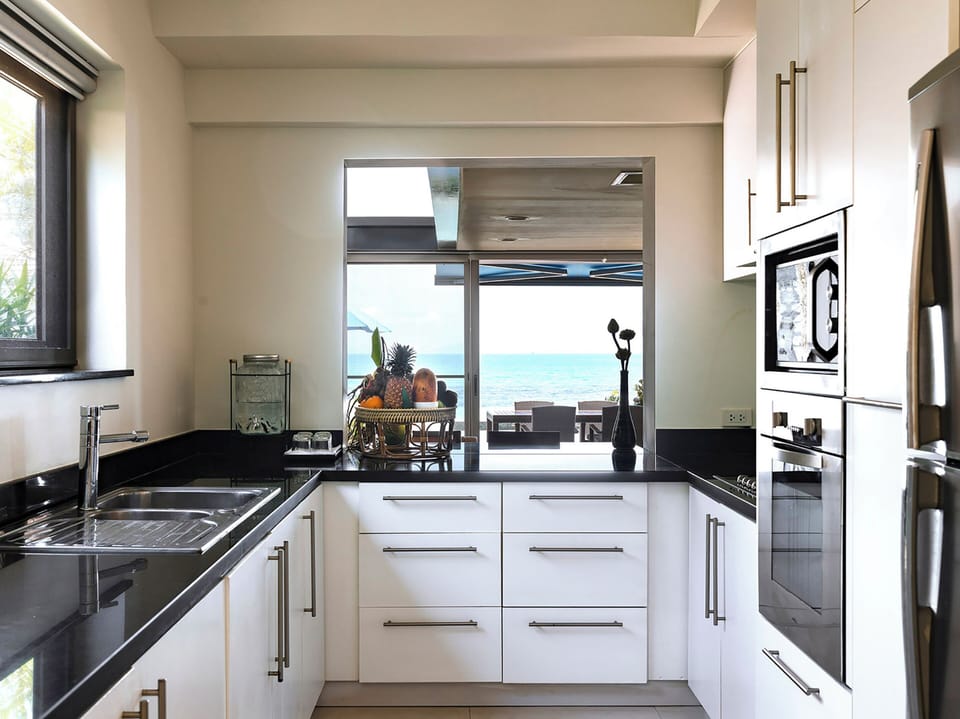 Villa, 4 Bedrooms | Private kitchen | Coffee/tea maker, full-size fridge, microwave, oven