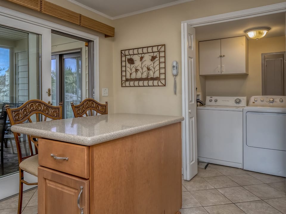 The laundry room with full size washer and dryer is off the kitchen.