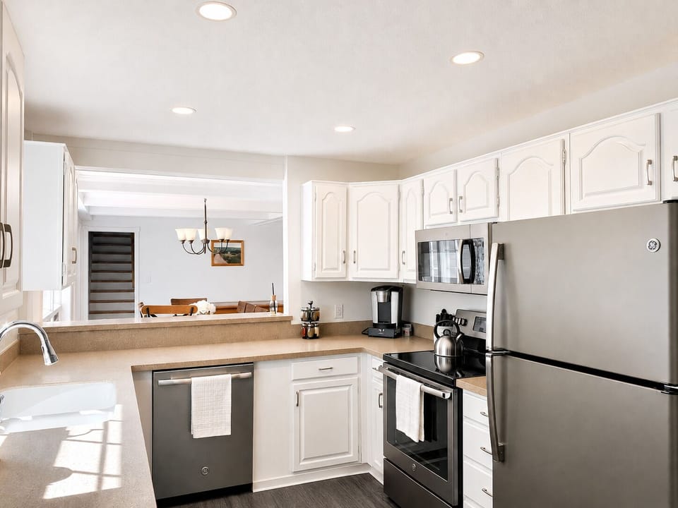 Stocked kitchen with new stainless steel GE appliances (including a dishwasher!)