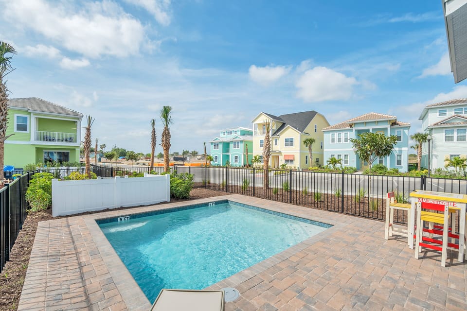 Sun-soaked Elegance: Bask in the glory of our outdoor swimming pool, where every moment is a picture-perfect escape, complemented by cozy lounge chairs for your utmost comfort.