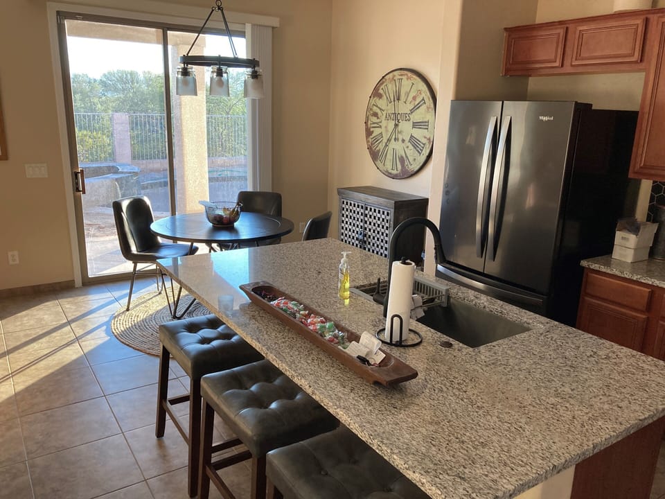 Sit at the kitchen counter or breakfast nook.