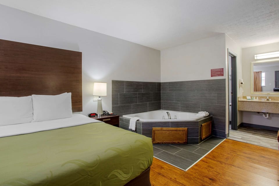 Desk, laptop workspace, iron/ironing board, free cribs/infant beds