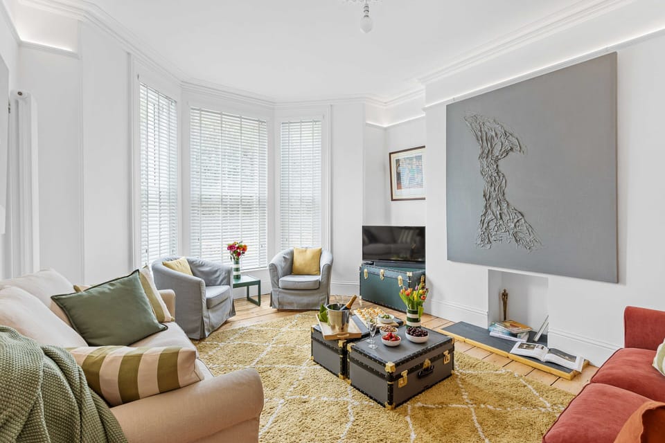 Sunny lounge, park views, comfy sofas, smart tech. A perfect relaxation vibe!