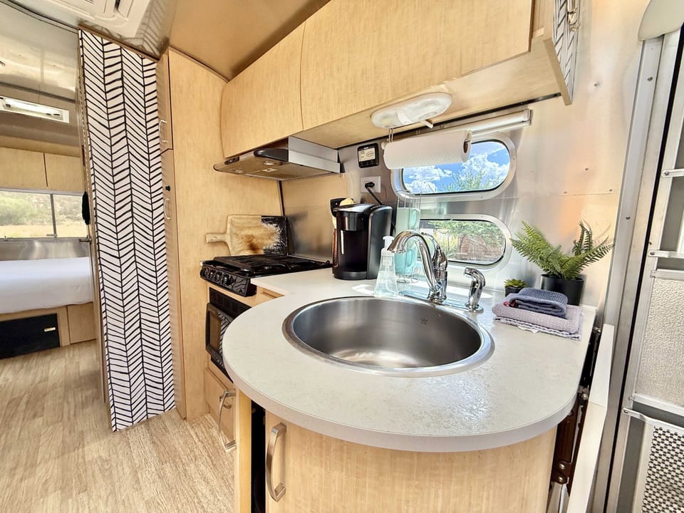 The kitchen is stocked with everything you need. Location meets comfort at Airstream 2