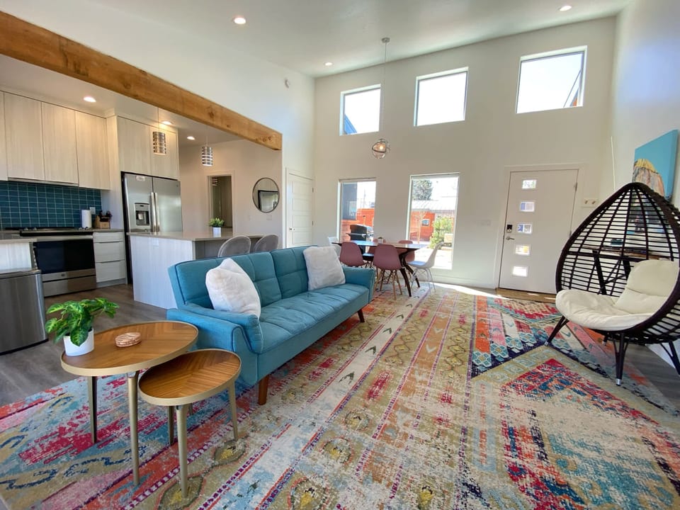 Step into the heart of Timber + Tin E, where a stylish living space awaits to welcome you.