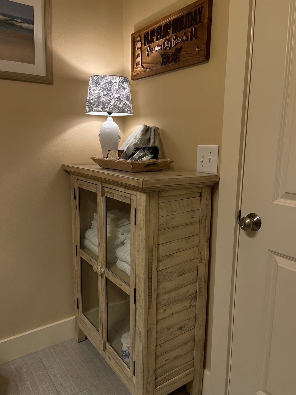Bathroom #3 downstairs features large walk in shower.  Cabinet with homey lamp added 2026.