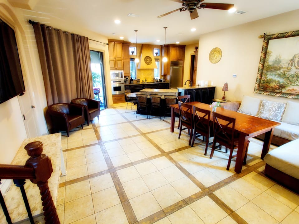 Open space living area with 55" 4K smart TV and extendable dining table