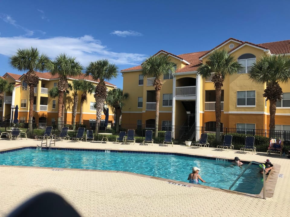Heated pool with seating, umbrellascovered seating. GRILLS