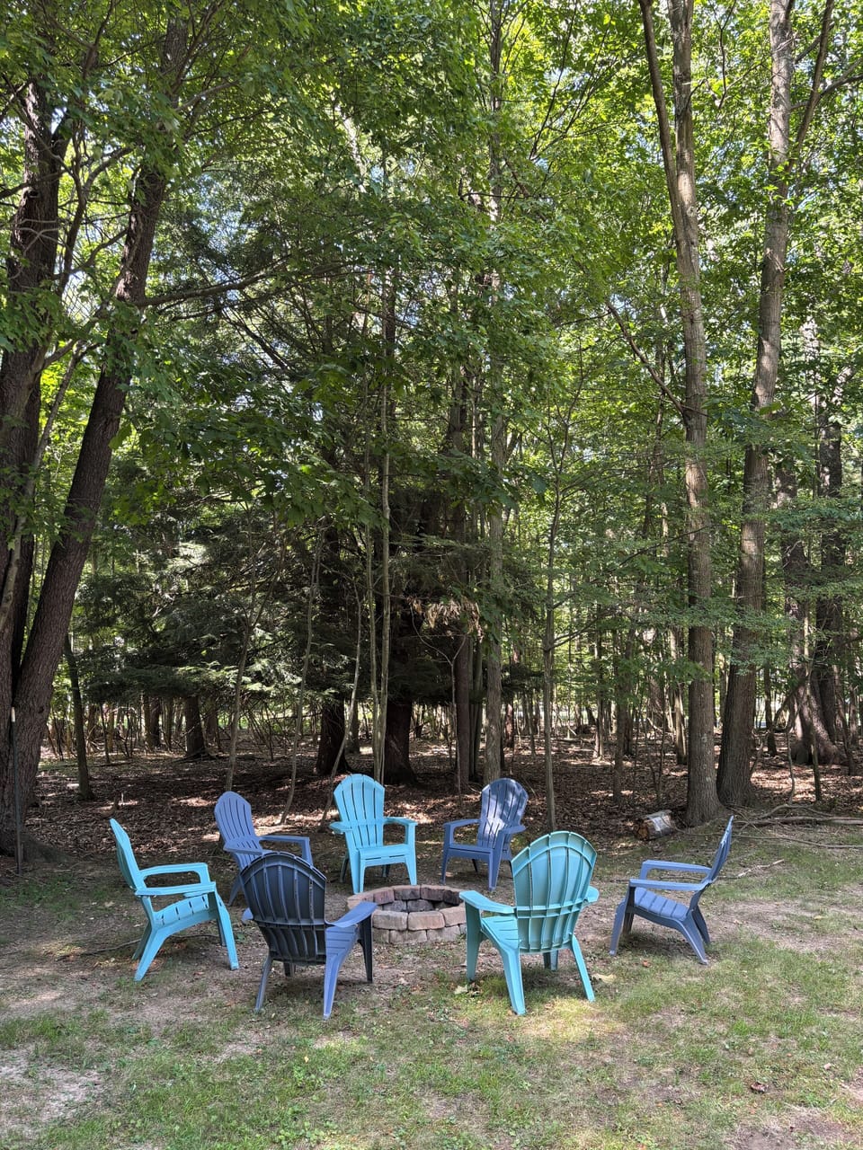 Roast s’mores by the campfire. Property surrounded by beautifully wooded areas.