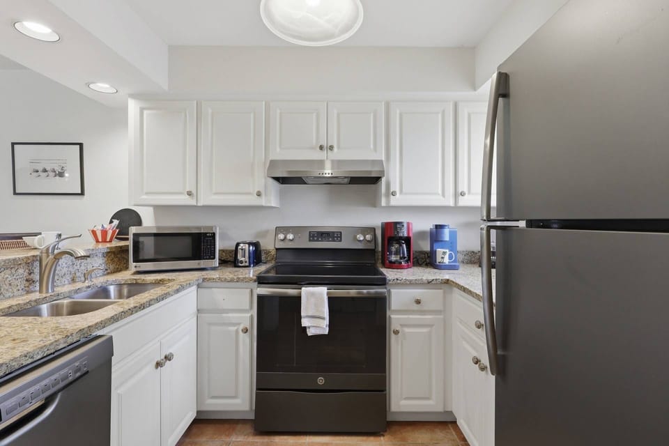 Clean and functional kitchen space designed for easy vacation cooking and entertaining.