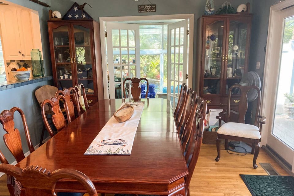 The oversized Dining Table opens up to seat 12 guests.