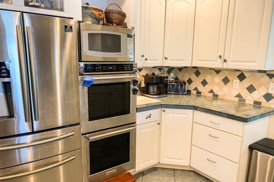 The gourmet kitchen's high end stainless steel appliances.