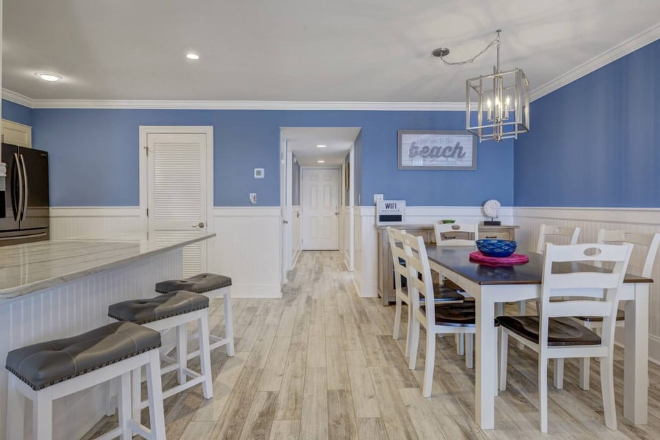 View from Living Area into Dining/Kitchen towards front entry
