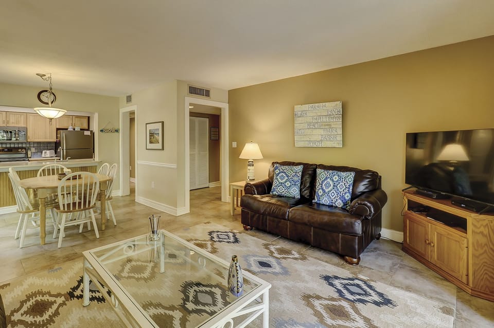 Living area - open floor plan with large TV for family movie nights!