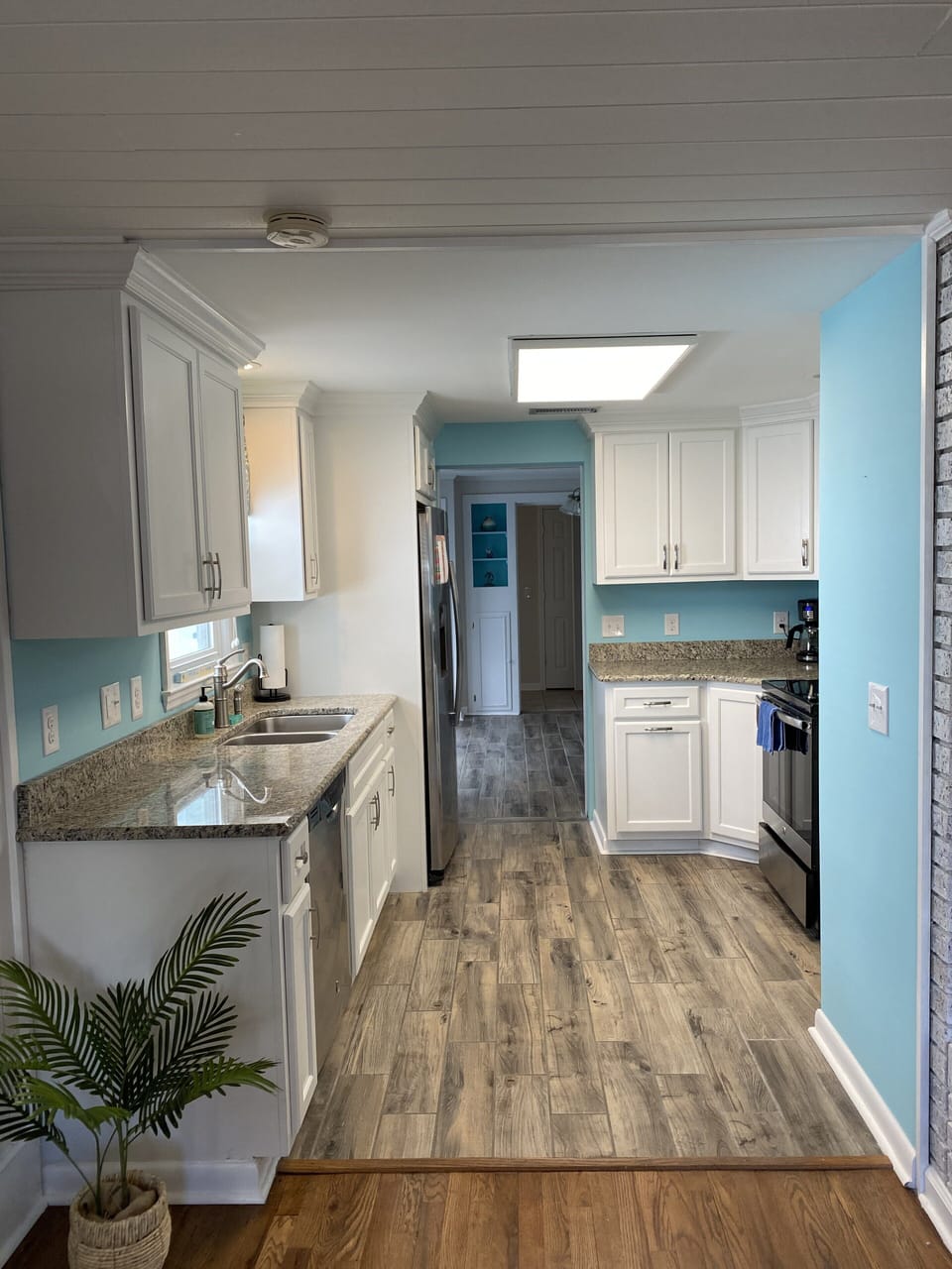 Kitchen, open to living room, see through to dining room. Fully stocked.
