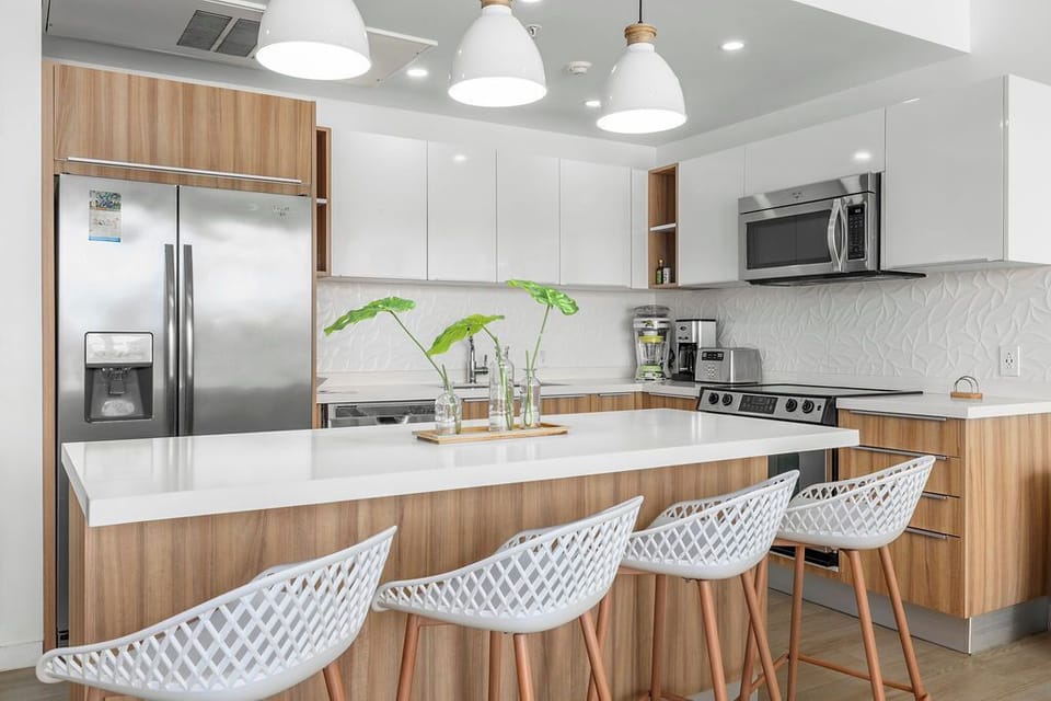 Your modern kitchen features sleek appliances and stylish bar seating where you'll love preparing meals and gathering with friends.
