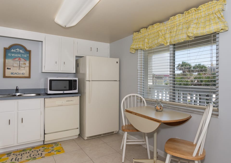 A kitchen and a table for two