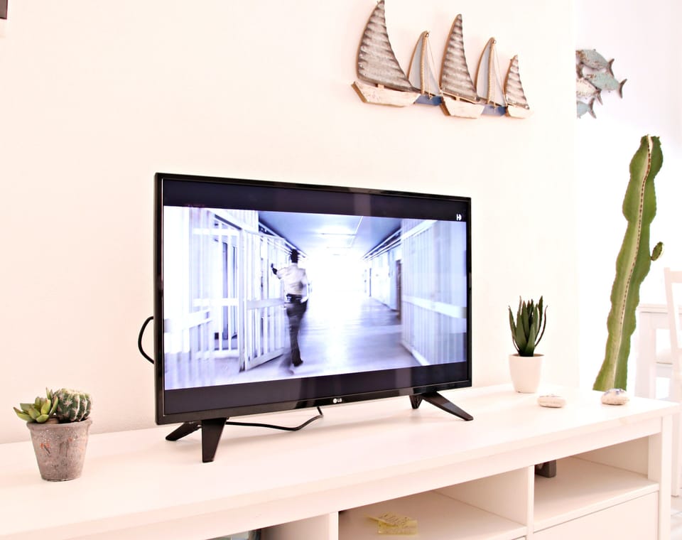 Deluxe Apartment | Living area | TV