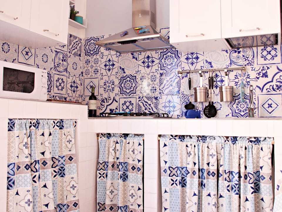 Deluxe Apartment | Private kitchen | Full-size fridge, coffee/tea maker, cookware/dishes/utensils