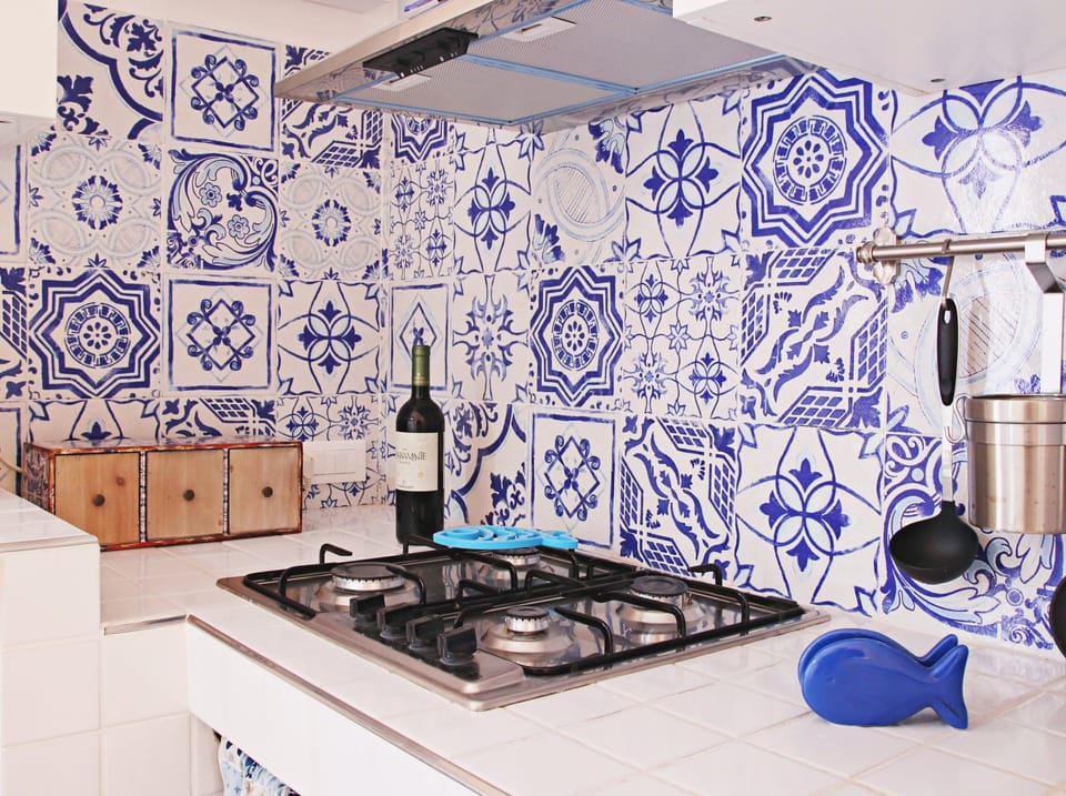 Deluxe Apartment | Private kitchen | Full-size fridge, coffee/tea maker, cookware/dishes/utensils