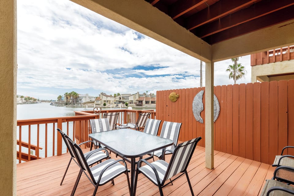 Savor morning coffee on your private waterfront deck, where canal views and gentle breezes create the perfect setting for relaxation.