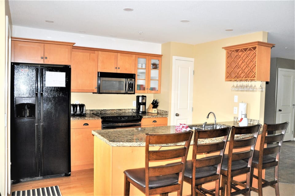 Gourmet kitchen with stone counters, ice maker and all the essentials