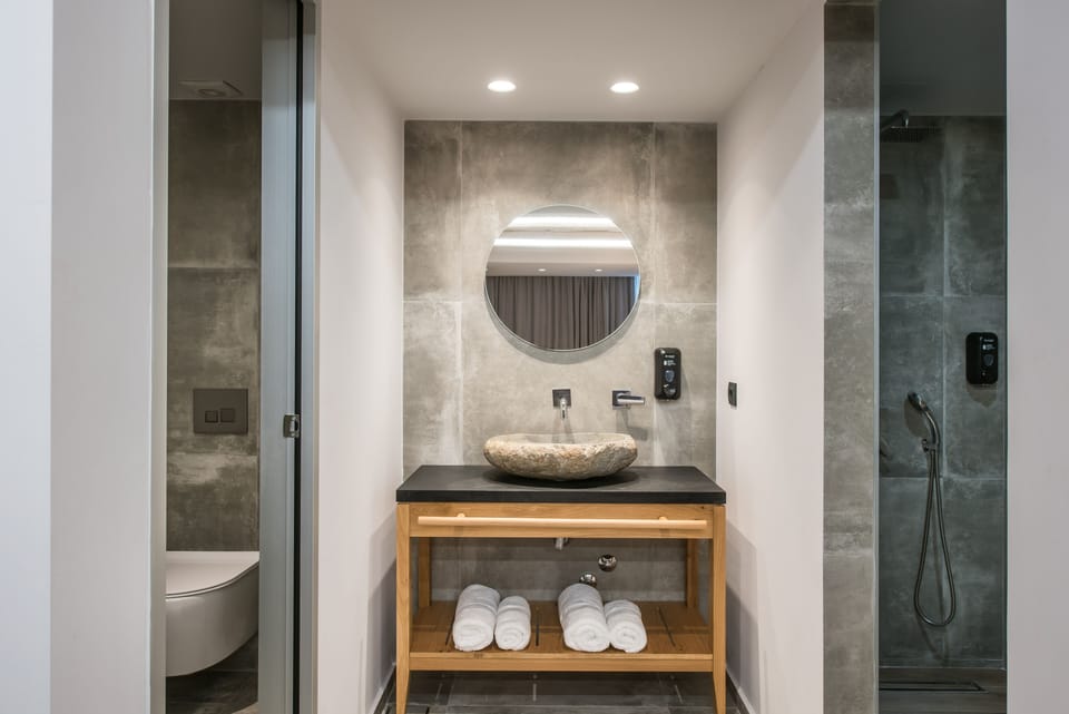 Junior Suite, Private Pool | Bathroom | Shower, hair dryer, towels
