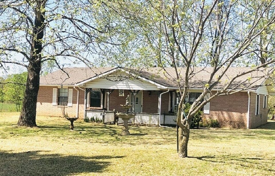 Exterior with front covered porch and sitting area