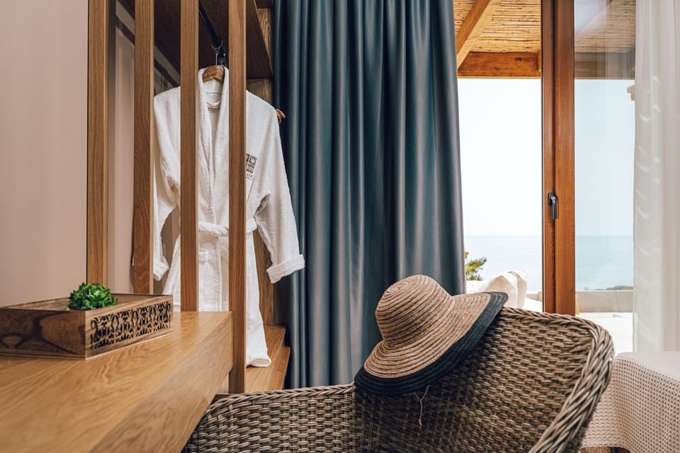 Master bedroom with en-suite bathroom, sea and pool view.