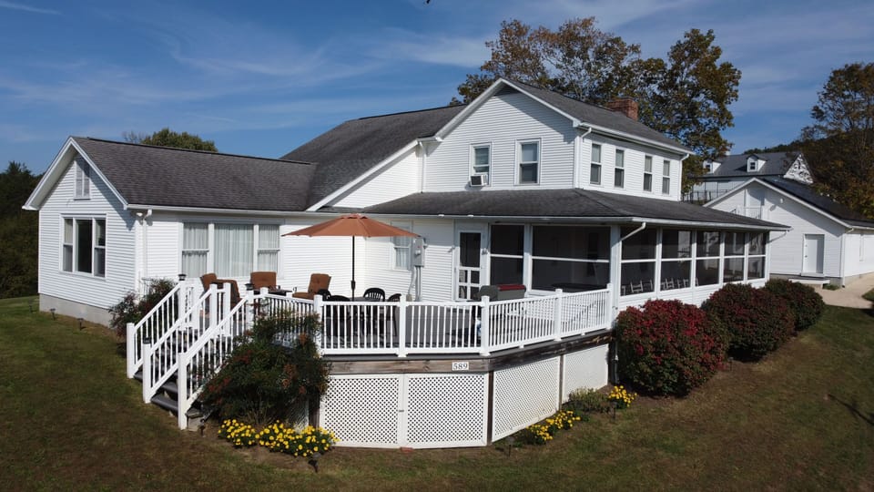 Spacious decks, screened porch, and large living spaces await you.