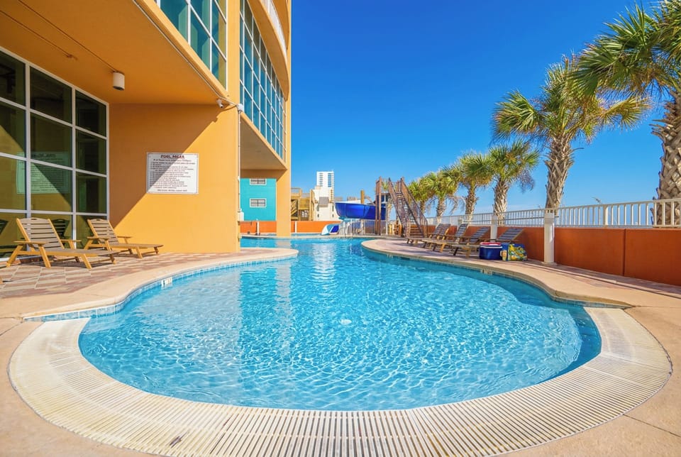 Relax by the pool with a view of the beach and enjoy the fun waterslide perfect for making your family getaway a splash