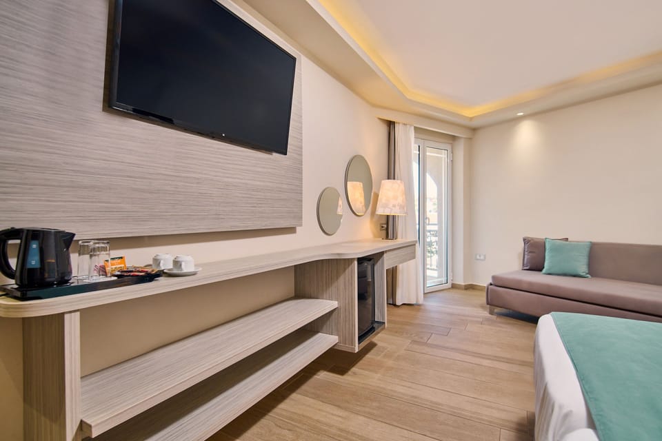 Comfort Room, Pool View | In-room safe, desk, iron/ironing board, free WiFi