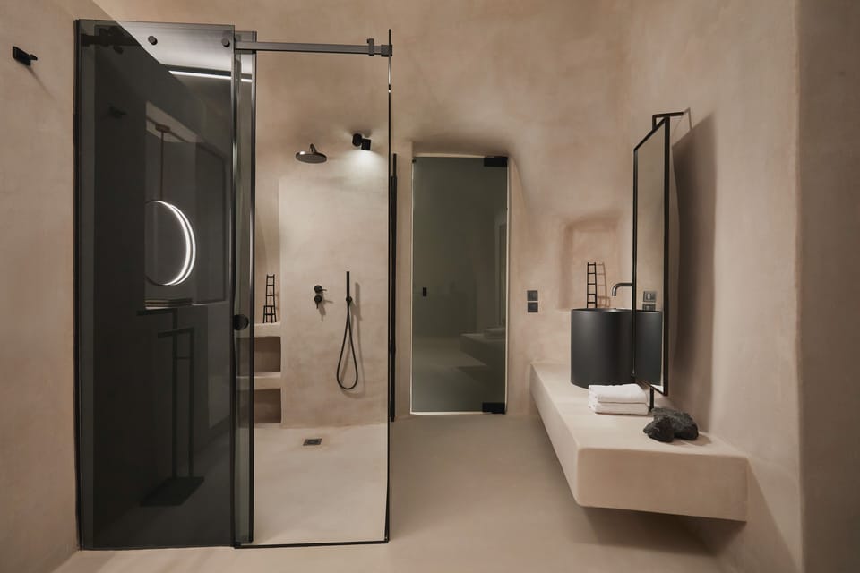 Elysium Cave Suite with Jetted Tub, Caldera View | Bathroom | Rainfall showerhead, free toiletries, hair dryer, bathrobes