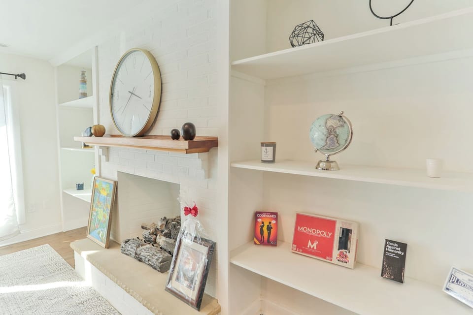 Board games like Monopoly (a must have in Atlantic City), Cards Against Humanity, and Codenames on display in our built-ins for game night!