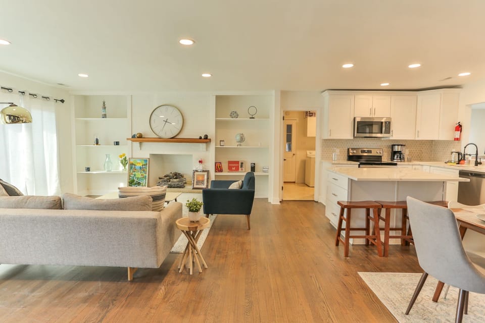 Open concept Living Area w/designer touches and Mid-Century Modern Furniture. Board games like Monopoly (a must have in Atlantic City), Cards Against Humanity, and Codenames on display in our built-ins.