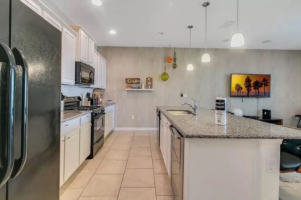 Luxuriously updated fully stocked kitchen with granite countertops. 