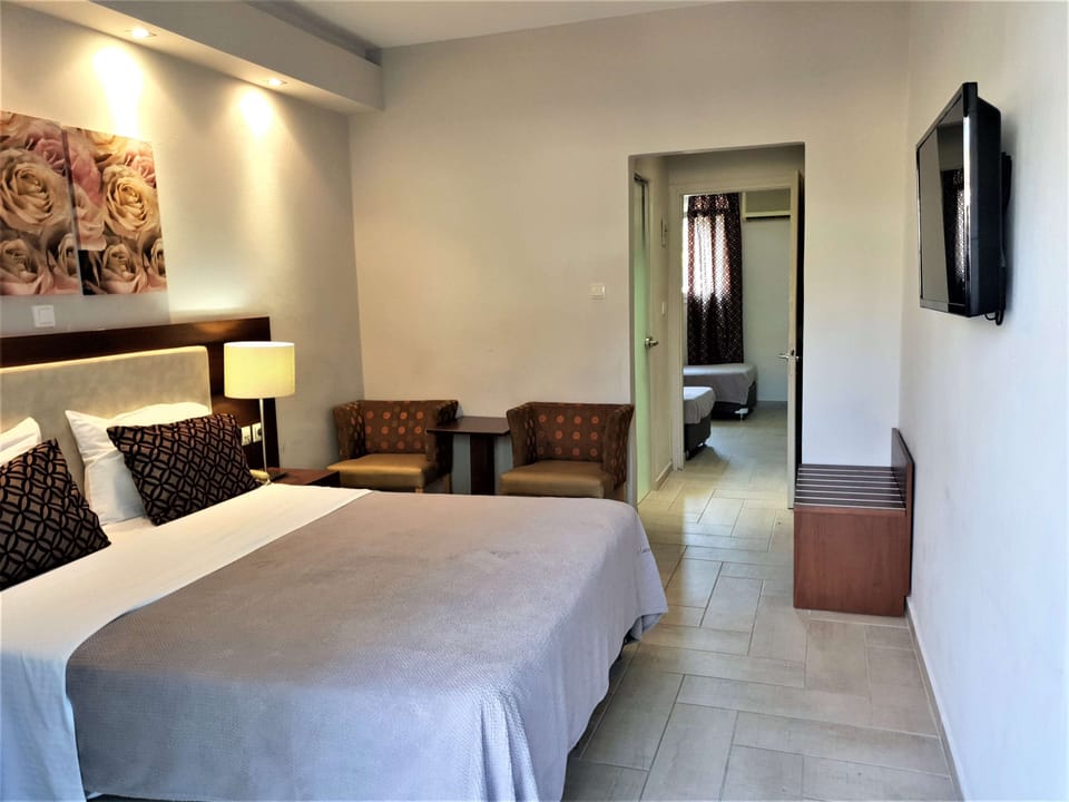 Family Room, Non Smoking, Garden View | In-room safe, desk, bed sheets