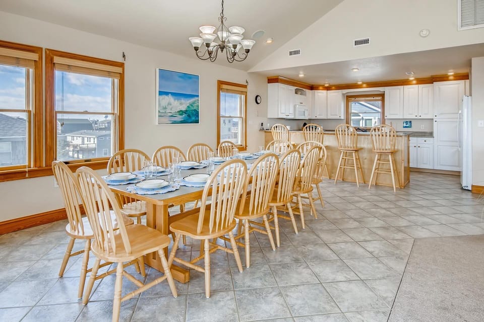There's plenty of seating for the entire group in the dining area with a 12-person dining table and adjacent 4-person breakfast counter.