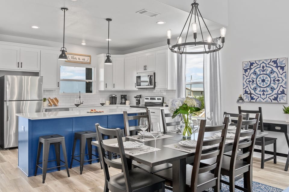 Open concept living, dining, and kitchen with a desk for working