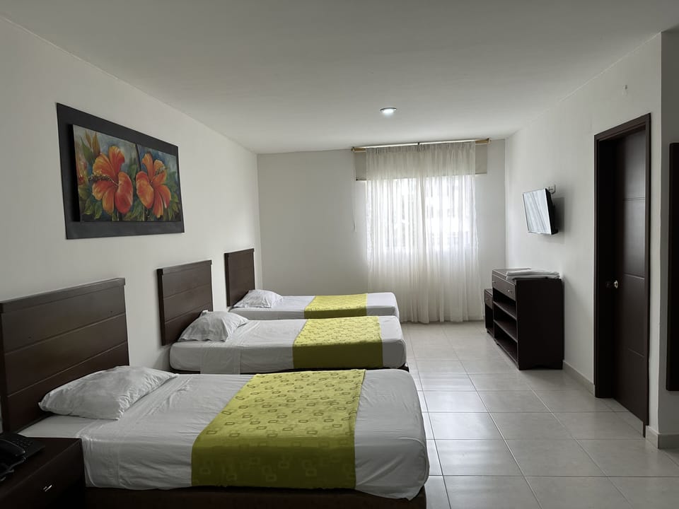 Basic Triple Room, Multiple Beds | Minibar, desk, laptop workspace, free WiFi