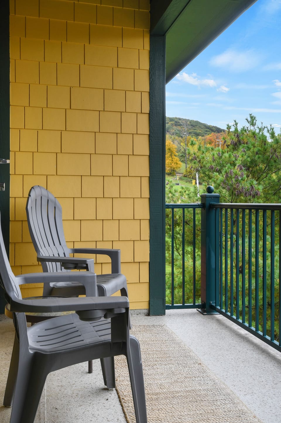 Private deck with view of the ski mountain and pool