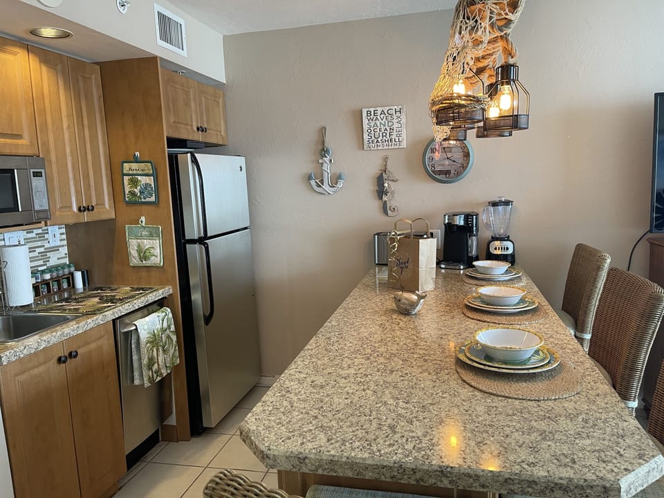 Coffee pot w/kcups, ground, cappuccino, toaster, blender, kups, tea, condiments.