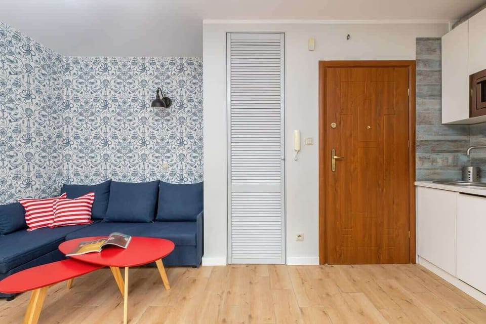 The bright living area is harmoniously combined with the functional kitchenette.